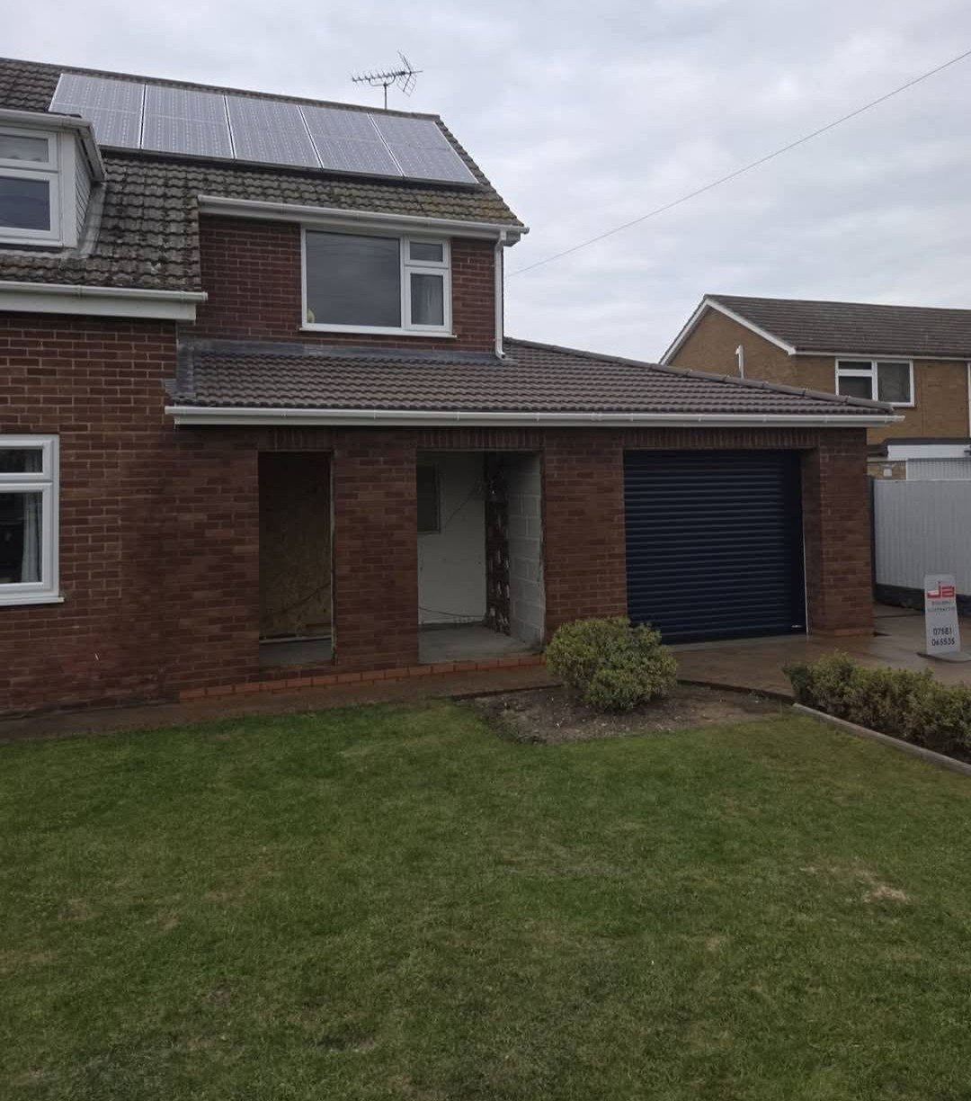 House extension with garage roller door, Nottinghamshire